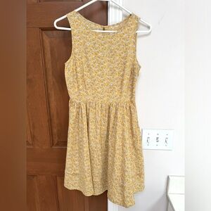 Adorable little cotton silk blend yellow with white flowers, sleeveless sundress